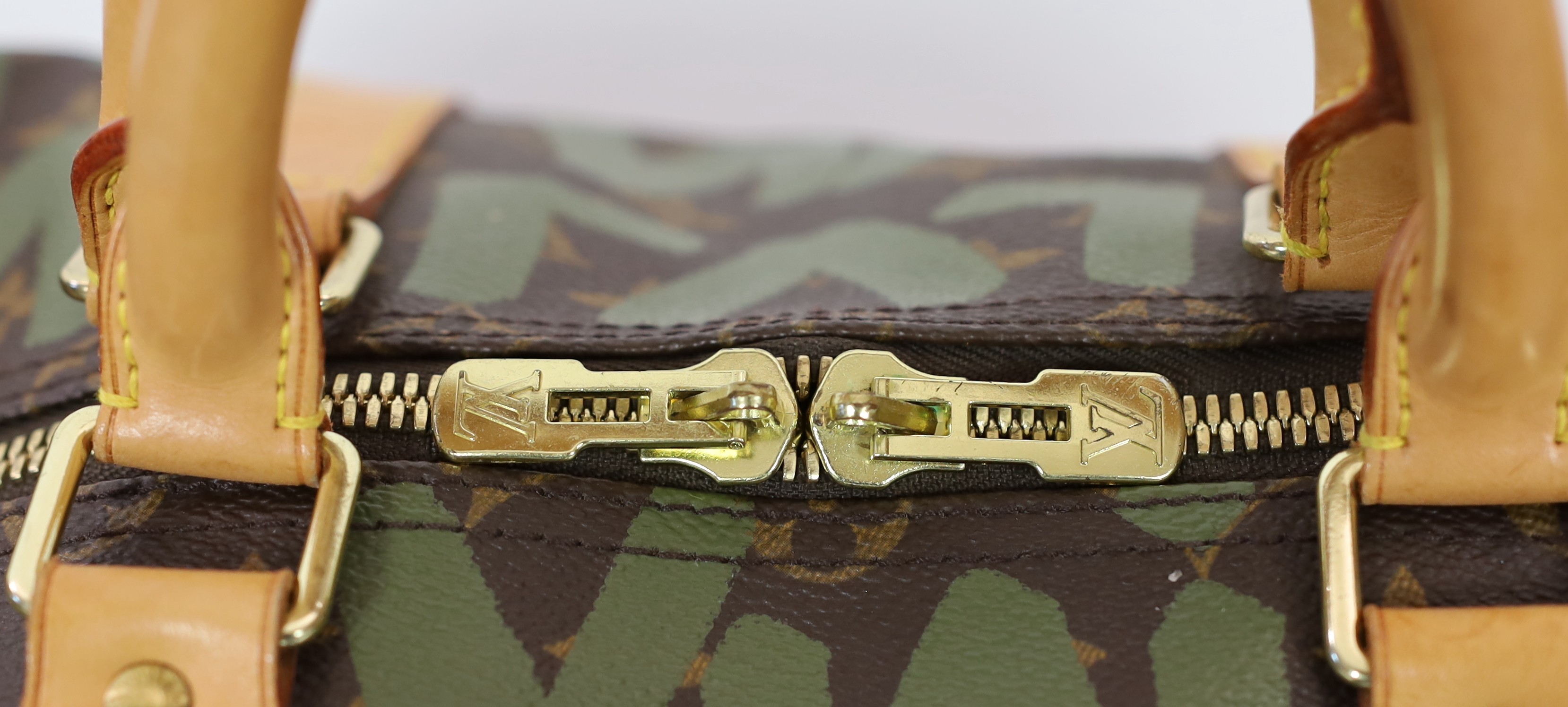 A vintage 2001 Louis Vuitton Stephen Sprouse Khaki Green Monogram Graffiti Keepall 50